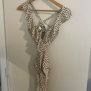 Size small one-piece swimsuit with cute cut-outs and flutter cap sleeves!